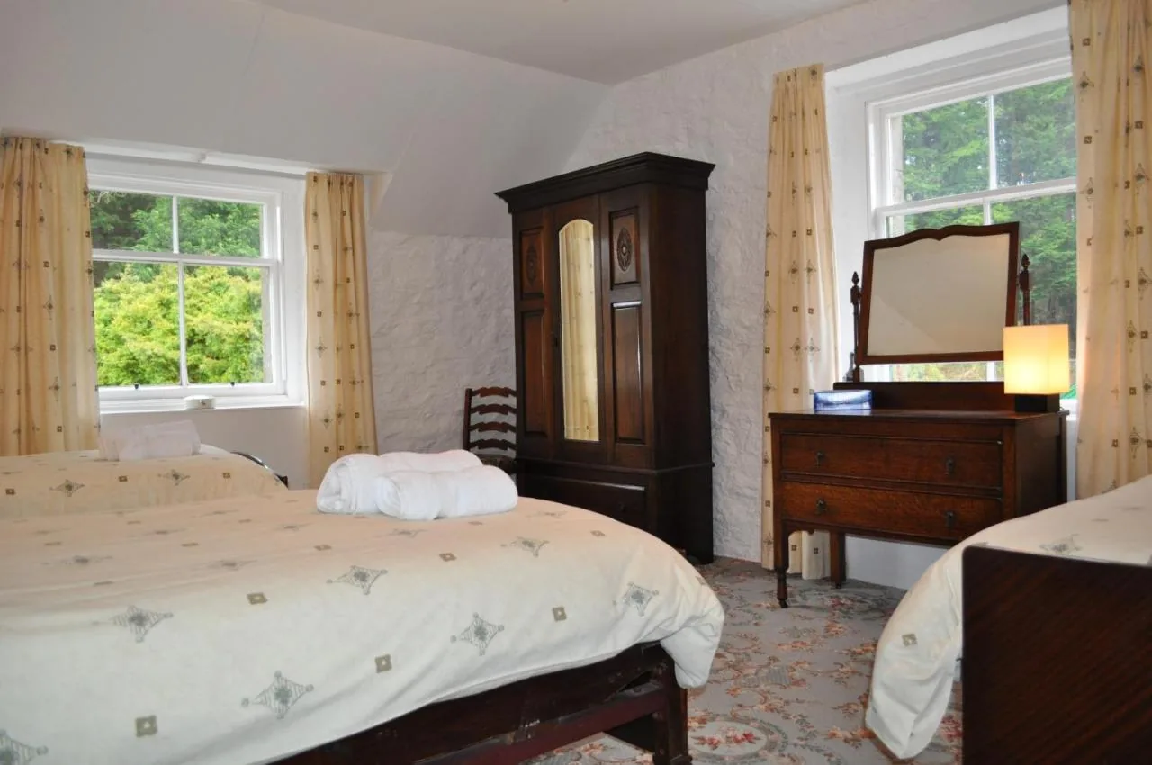 Double bedroom with traditional furniture in one of the Auchmore apartments
