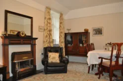 Lounge and dining area in the Lawers Apartment with living flame fire
